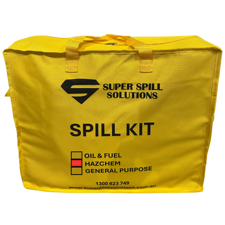 Yellow spill kit bag with the text 'SUPER SPILL SOLUTIONS SPILL KIT' printed on it, along with hazard symbols and a phone number.