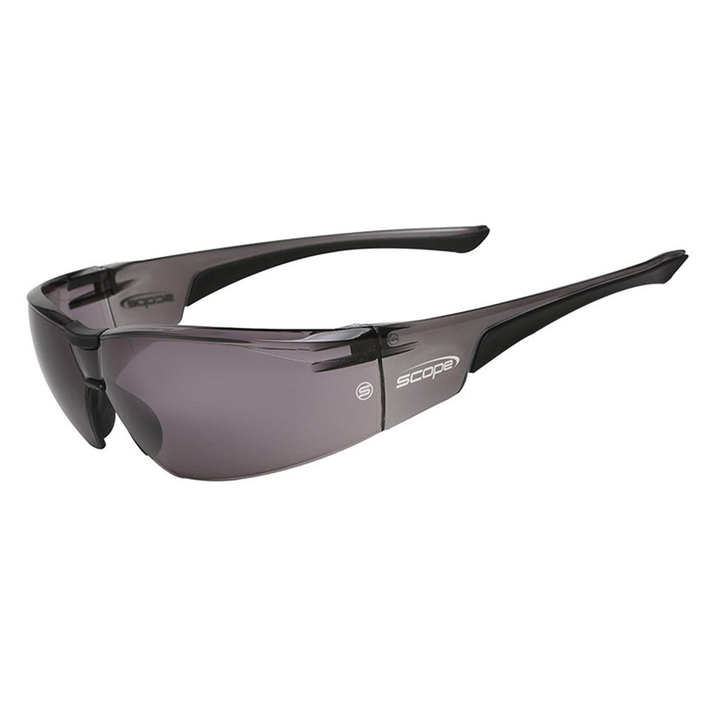 A pair of protective eyewear with a one-piece rimless polycarbonate frame, featuring a black rubber nose bridge and flared side temples.