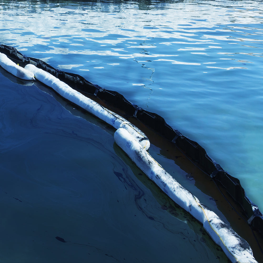 Floating Oil & Fuel Boom on water containing a oil spill