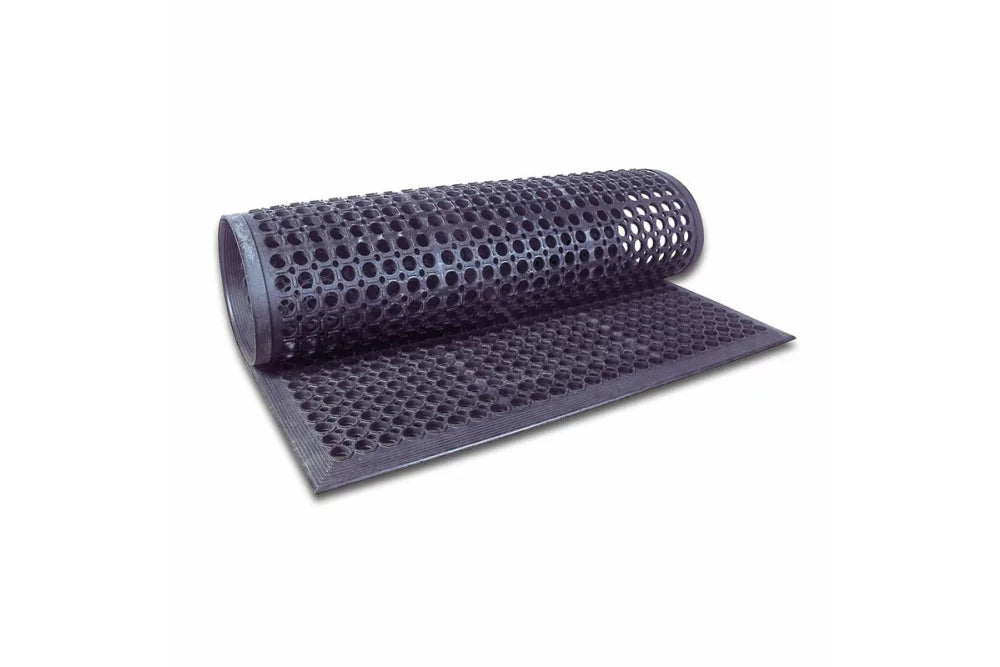 A rolled up black anti-fatigue floor mat with a honeycomb pattern.