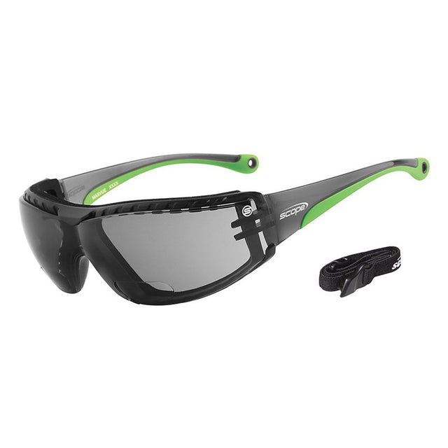 A pair of eyeglasses featuring a black frame with green accents, smoke lenses, and an adjustable elastic strap, alongside a pair of detachable clear lenses.