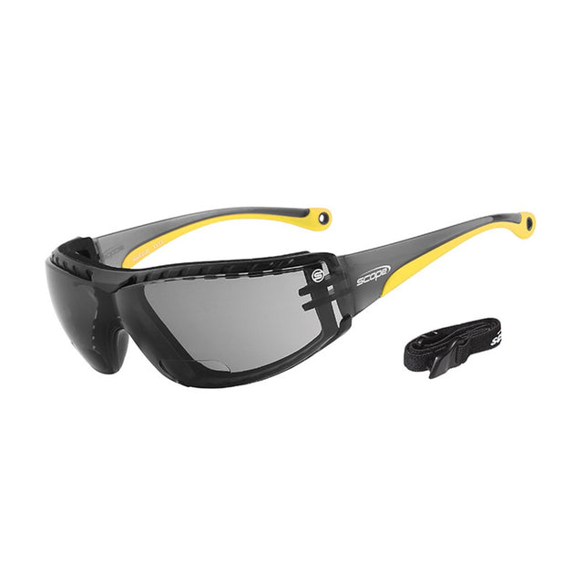 Protective eyewear with black frame and yellow accents, featuring a smoke lens and an adjustable elastic strap.