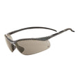 A pair of protective eyewear with a half-frame dual-lens design, featuring a carbon fibre gloss finish, rubber temple tips, and rubber nose pads.