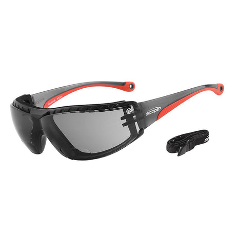 A pair of eyeglasses featuring smoke lenses and a black frame with red accents, including a form-fitting SBR rubber gasket and an adjustable elastic strap.