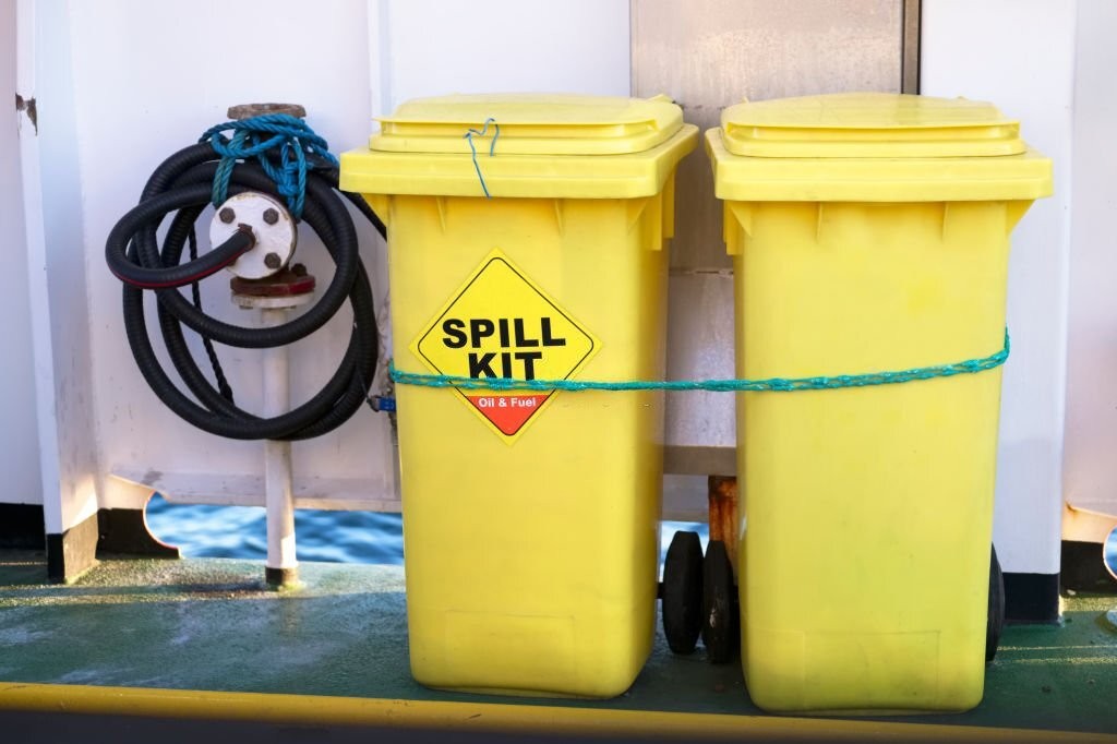 What are the typical contents of a spill kit?