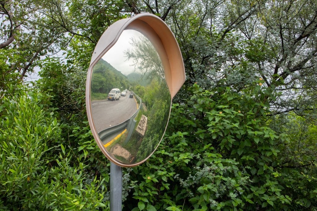 What is a convex mirror and what are its uses?