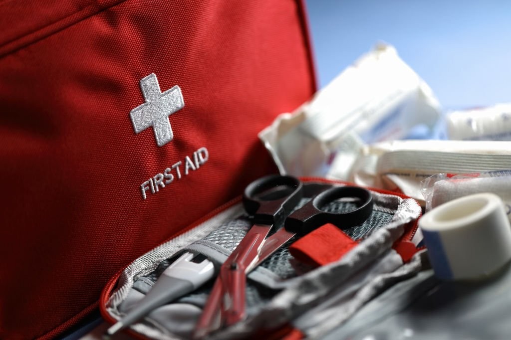 How do I use the items in a first aid kit effectively?
